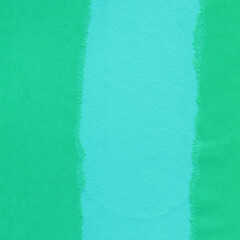 Blue torn paper collage close-up. Texture made from various paper and cardboard parts. Damaged old paper background. Vintage blank wallpaper. Material design backdrop.