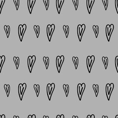 Seamless fabric with the image of a heart on a gray background.