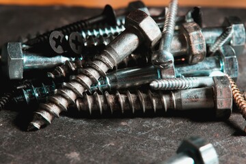 Group of screws on a table in a Workshop