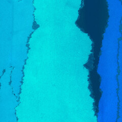Obraz premium Blue torn paper collage close-up. Texture made from various paper and cardboard parts. Damaged old paper background. Vintage blank wallpaper. Material design backdrop.