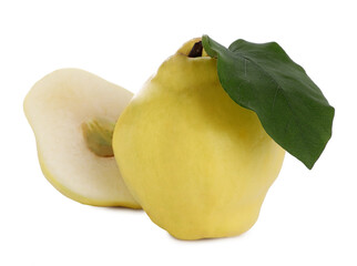 Whole and cut delicious quinces on white background