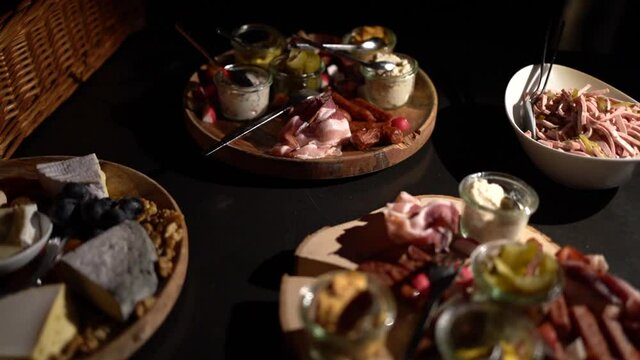 appetizer with meat and cheese on a dark background