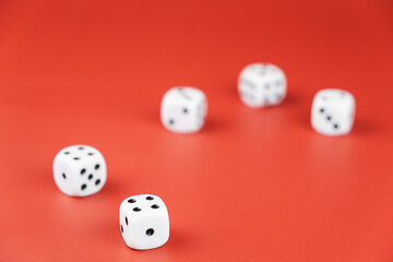 five dice lie on a red background. gambling and luck