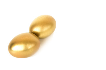 Golden easter eggs isolated on white background. Decorative easter decorations. Easter card. Flat layout.