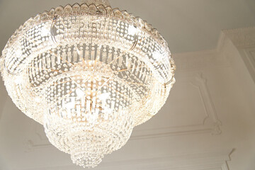Obraz premium Chrystal chandelier close-up. Glamour background with copy space. Selective focus.