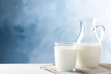 Delicious fresh milk on white table. Space for text