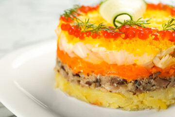 Traditional russian salad Mimosa on plate, closeup