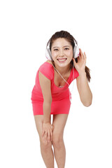 Young woman in pink dress with headset