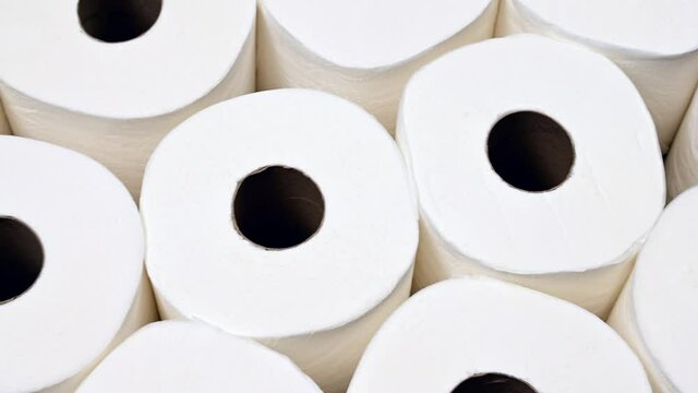 Closeup panning shot of toilet paper supply