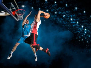 Schilderijen op glas Two basketball players in arena. Blocked shot © Andrey Burmakin