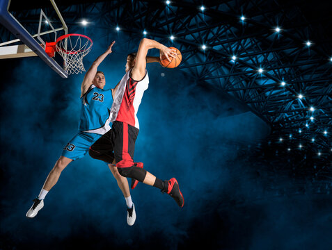 Two Basketball Players In Arena. Blocked Shot