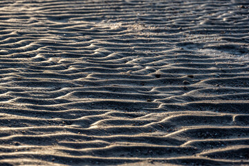 beach sand at low tide at sunset