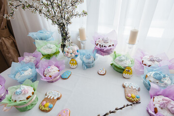 Beautiful Easter cakes on a decorated light table. A light holiday of Easter.