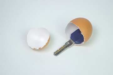 Keys inside an eggshell. Keys to the new apartment. Buying a property. House keys