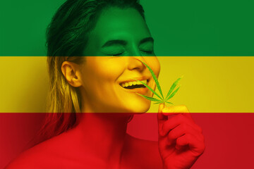 Beautiful woman with a cannabis leaf in colors of Rastafarian flag