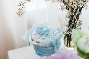 Beautiful Easter cakes on a decorated light table. A light holiday of Easter.