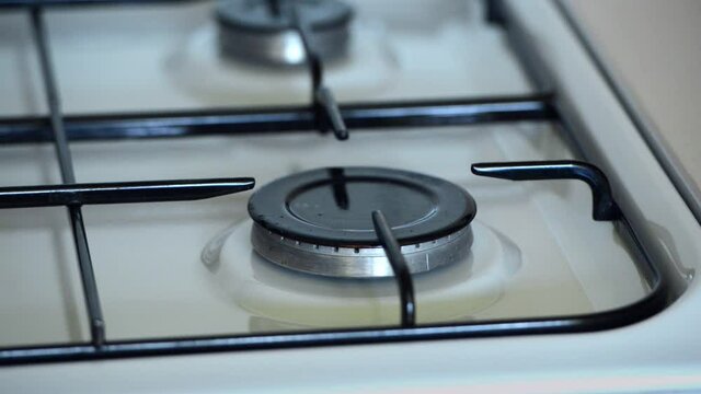 The gas burner lights up in the kitchen
