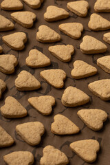 Fototapeta na wymiar Heart-shaped cookies on a baking sheet