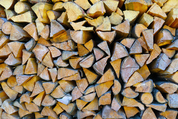 The chopped wood is in a stack in storage.