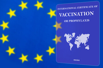 Obraz na płótnie Canvas Certificate confirms vaccination against covid-19. Vaccination document due to covid-19. Immune passport on background of EU flag. Certificate allows you to travel to countries of European Union