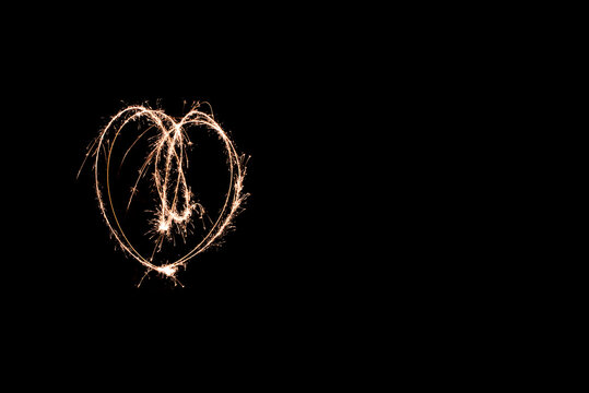 glowing heart light painting at night with a sparkler. creative movement photography - Powered by Adobe