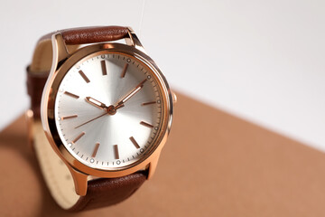 Luxury wrist watch on color background, closeup. Space for text