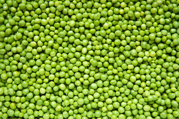 Fresh green peas as background. 