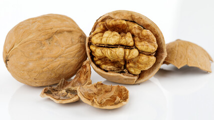 some cracked walnuts isolated on white background