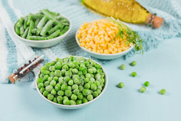 Green peas, sweet corn and cut green beans in bowl. Concept of homemade preparations for fast cooking. Healthy vegetarian food concept
