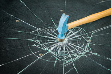 Hammer and broken safety glass