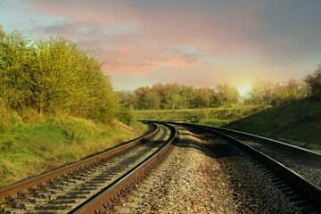 Fototapeta na wymiar Railway lines in countryside on sunny day. Train journey
