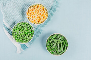 Green peas, sweet corn and cut green beans in bowl. Concept of homemade preparations for fast cooking. Healthy vegetarian food concept