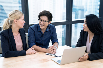 Estate agent shaking hands with customer after contract signature, Successful lawyer giving consultation to family couple about buying house.