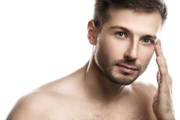 Naklejka premium Young and handsome man with smooth skin on white background