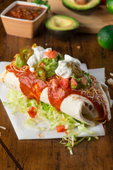 Burritos or tacos. Mexican or Tex-Mex food favorite. Seasoned meat, refried or black beans, Mexican rice, cheese, fried vegetables wrapped in homemade tortillas and served with salsa. Takeout favorite