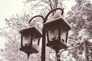 Old vintage iron street lamp in winter