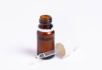 isolate, glass vial with pipette on white background