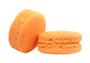 Two chocolate macarons isolated on a white background.