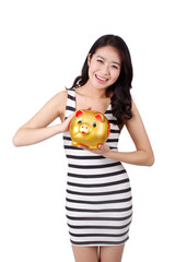 Young woman in a striped dress holding a piggy bank