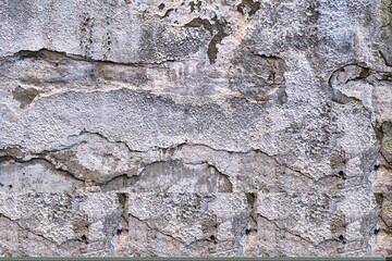 Old wall. Old peeling white paint on concrete wall, texture background