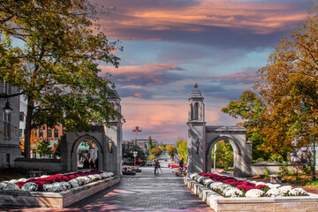 Overlooking Bloomington Indiana from University entrance on fall day at sunset with flowers and a...