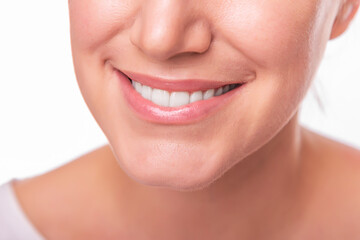 Obraz premium Female face with white teeth isolated on white background.