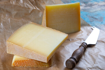 Cheese collection, French comte and Swiss gruyere cheeses © barmalini