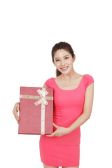 Young woman in pink dress holding gift box