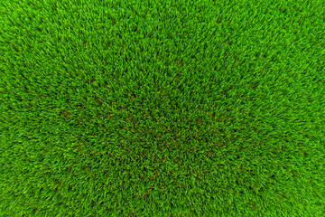 Top view texture of a beautiful artificial grass field. Bright green artificial grass background.