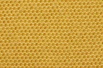 Texture of yellow cotton fabric, close-up.