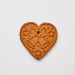 New Year gingerbread or heart shaped cookies isolated on white background. Square image. Top view.