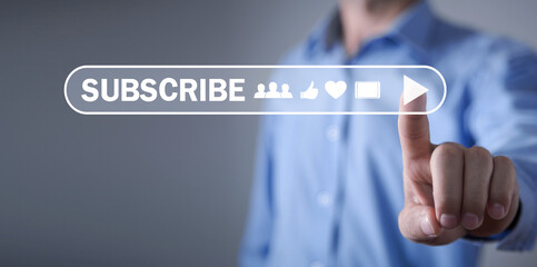 Male hand pointing Subscribe button. Social media