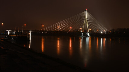 bridge at night, lights reflections on the wather