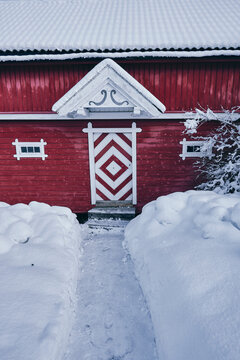 red storehouse in snow
